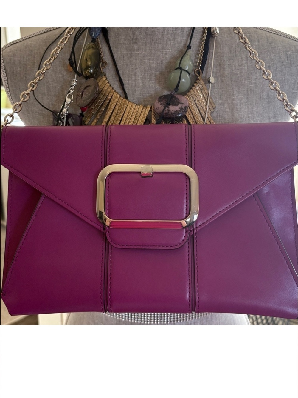 Banana Republic envelope clutch featuring buckle accent and chain strap
